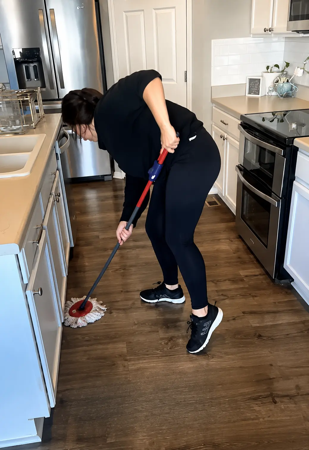 A person mopping the floor